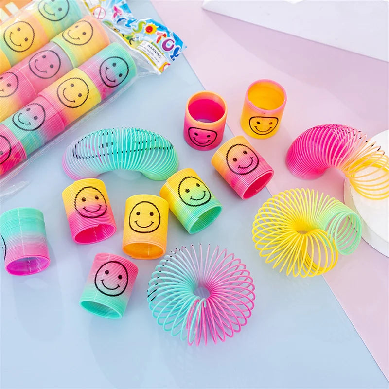12Pcs Mini Smiley Face Rainbow Neon Magic Spring Toys