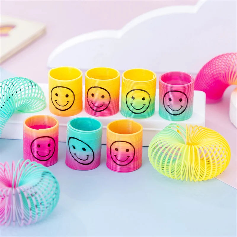 12Pcs Mini Smiley Face Rainbow Neon Magic Spring Toys Random Color
