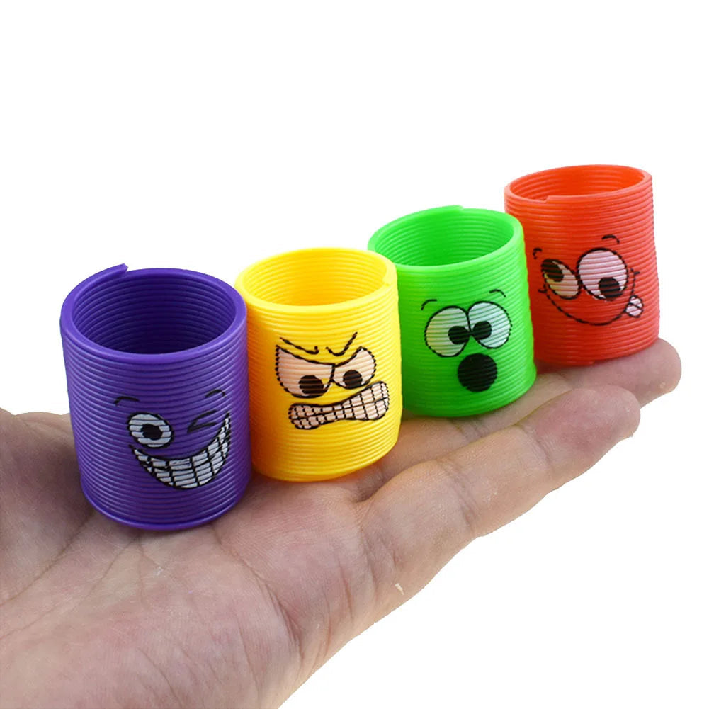12Pcs Mini Smiley Face Rainbow Neon Magic Spring Toys Spoof Random