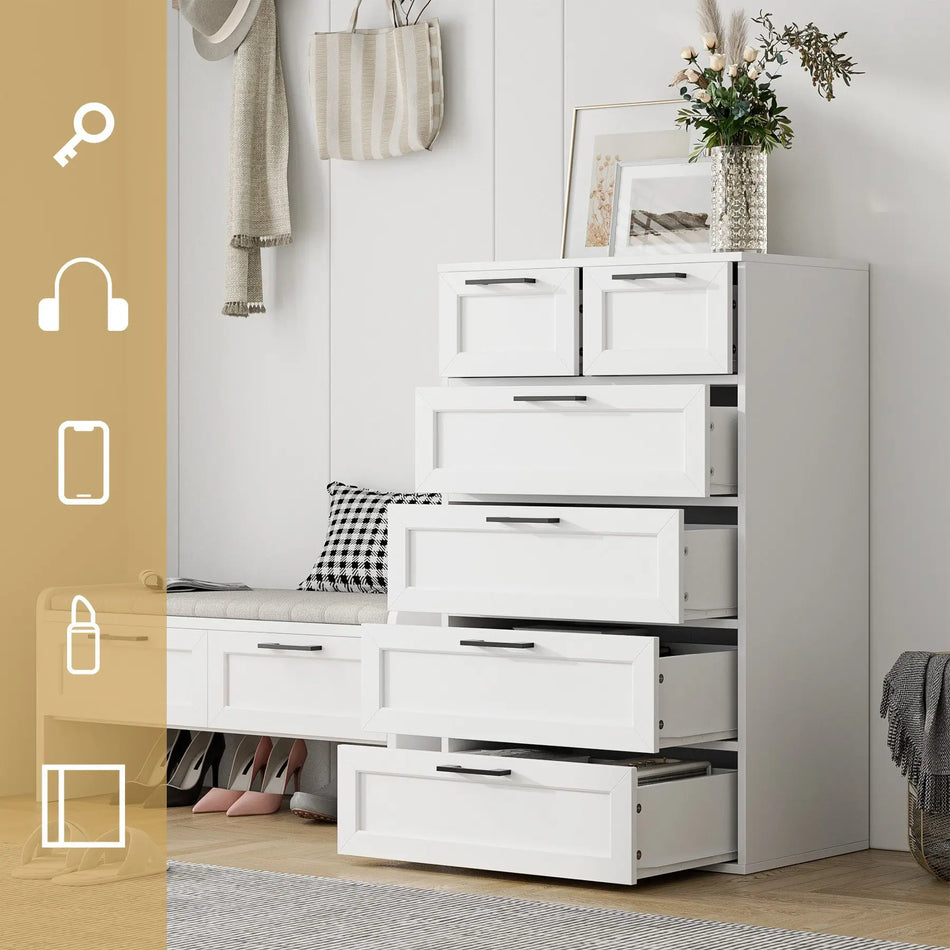 Valkoinen lipasto, jossa on kuusi laatikkoa, kapea vaatekaappi makuuhuoneeseen