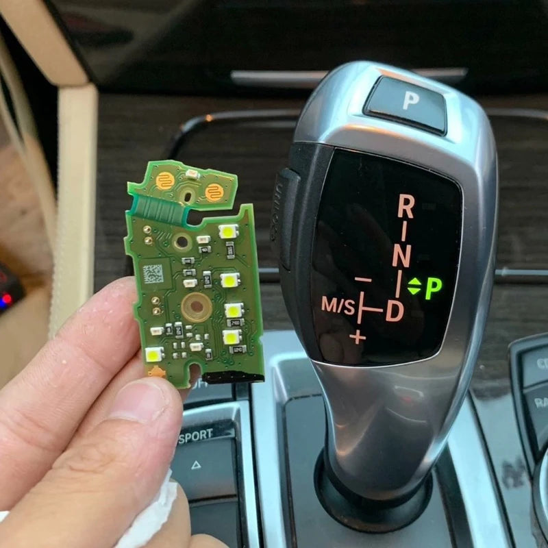 Pārnesumu pārslēga pogu shēmojums BMW F10 F30 F31 F32 F20 F07 F25 F26 F15 F16